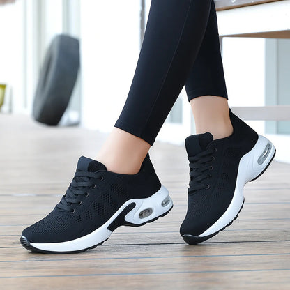 Woman wearing black OrthoStep air cushion walking shoes